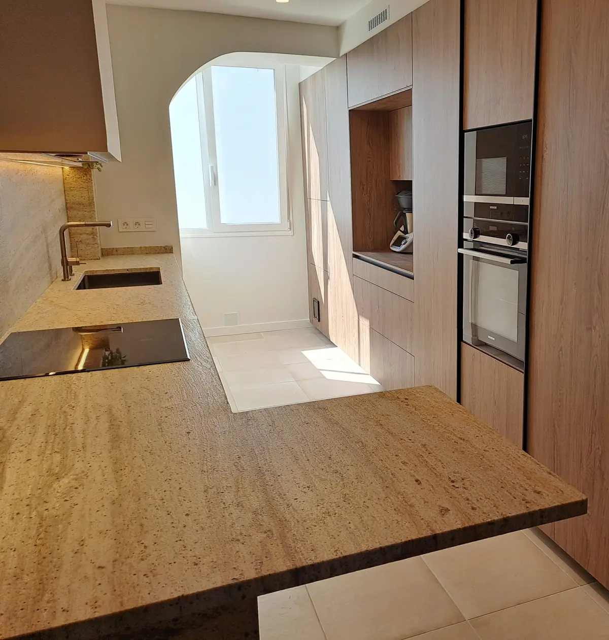 Marble countertop with integrated sink and full height wooden cabinetry - Pontevedra